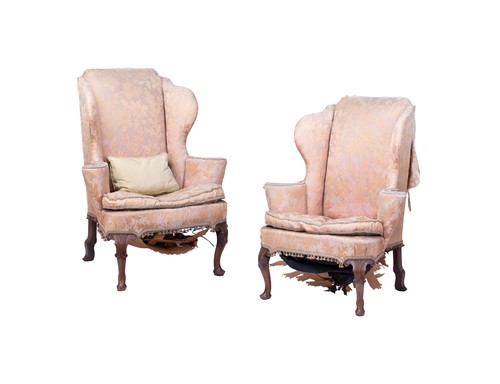 Lot 70 - A pair of George II style wing armchairs, with...