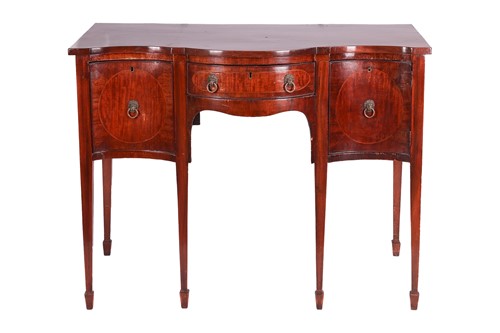 Lot 92 - A Regency mahogany serpentine sideboard, the...