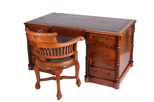Lot 76 - A late 19th-century walnut kneehole desk, with...