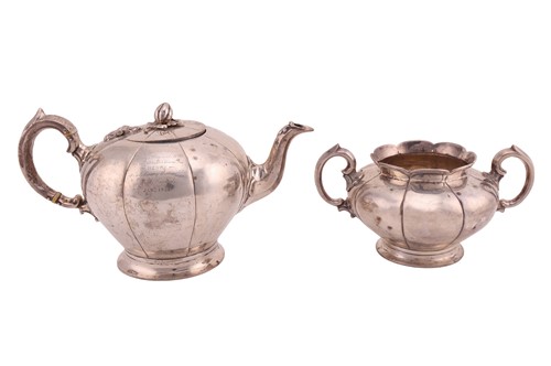 Lot A Victorian silver presentation teapot and...