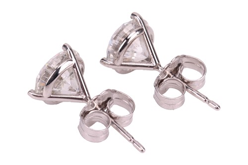 Lot A pair of diamond stud earrings, with an...