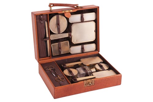 Lot 226 - A cased silver-mounted dressing table set, by...