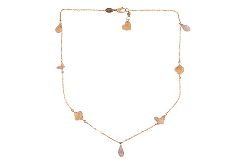 Lot A three-tone necklace, comprising segments of...