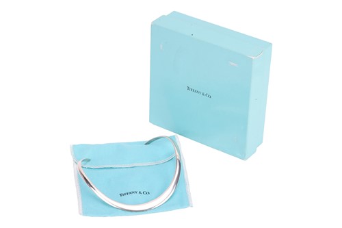Lot 76 - Tiffany & Co. - a silver torque necklace,...