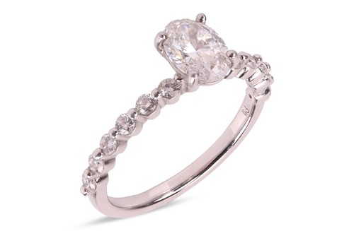 Lot 264 - A diamond solitaire ring, featuring a central...