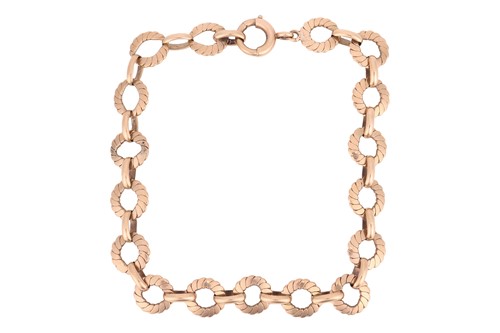 Lot A fancy link bracelet in 9ct yellow gold,...