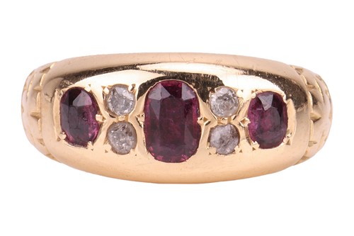 Lot 45 - A ruby and diamond half hoop ring in 18ct gold,...
