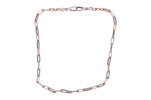 Lot 31 - A Continental Niello watch chain, terminated...