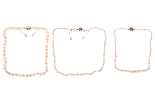 Lot 16 - Three cultured pearl necklaces, each with a...