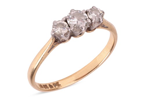 Lot 256 - A diamond three-stone ring, featuring three...