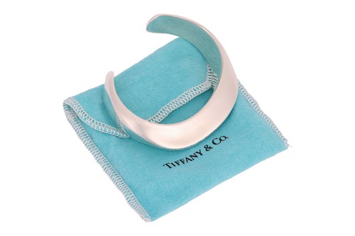 Lot 77 - Tiffany & Co. - a 'Swirl cuff' by Elsa Peretti,...