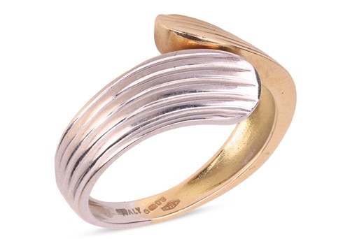 Lot 80 - A two-toned bypass ring in 18ct gold, of...