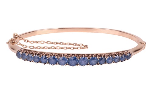 Lot 19 - A Late Victorian hinged bangle set with...