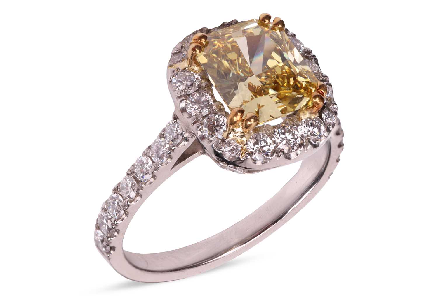 Lot A yellow diamond halo ring, the central...