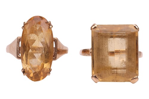Lot 9 - Two citrine dress rings; to include a...