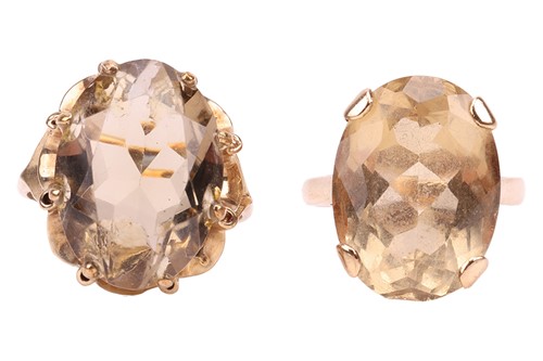 Lot 17 - Two 9ct gold citrine dress rings; the first...