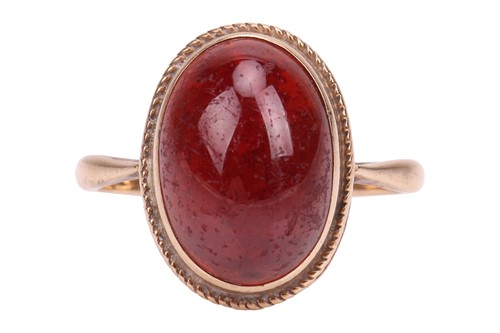 Lot 19 - A spinel cabochon ring in 9ct gold, collet-set...