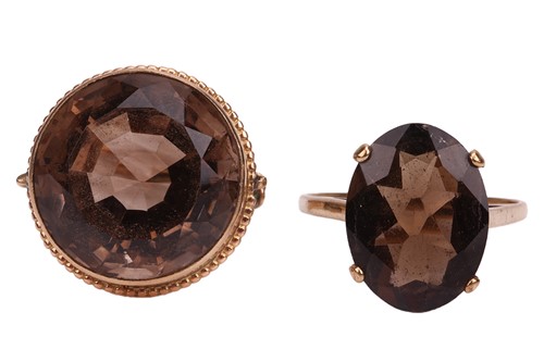 Lot 35 - Two smoky quartz rings; the first contains a...