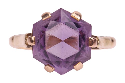 Lot 36 - An amethyst dress ring, the hexagonal-cut...