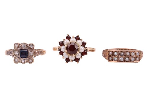 Lot 32 - Three rings; The first a synthetic sapphire...