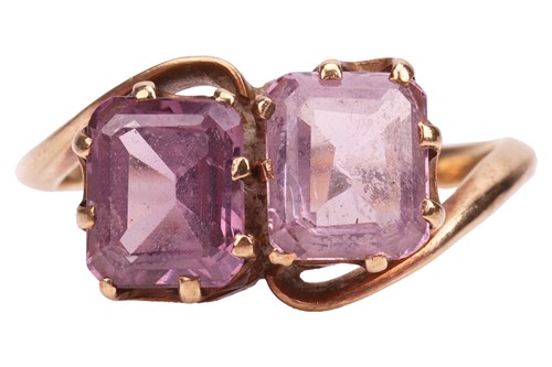 Lot 39 - A crossover ring set with two pinkish purple...