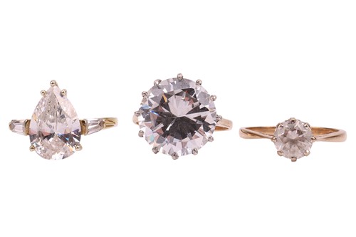 Lot 34 - Three dress rings set with cubic zirconia in...