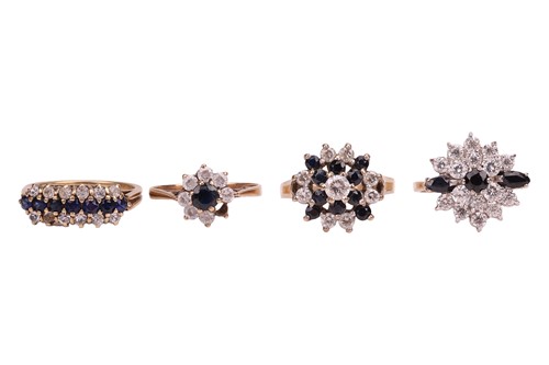 Lot 41 - A collection of four gem-set rings in 9ct gold;...