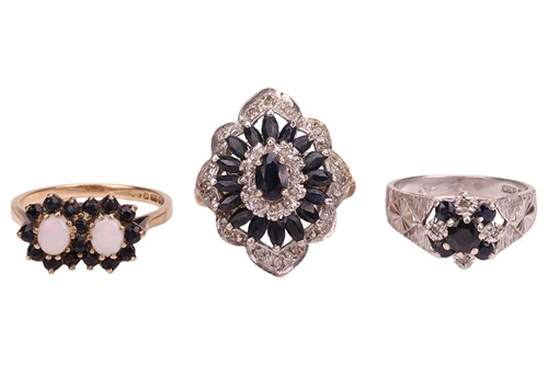 Lot 52 - Three gem-set dress rings, each of cluster...