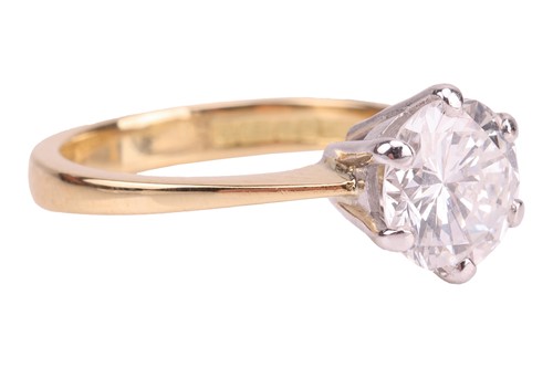 Lot A diamond solitaire ring in 18ct gold, the...