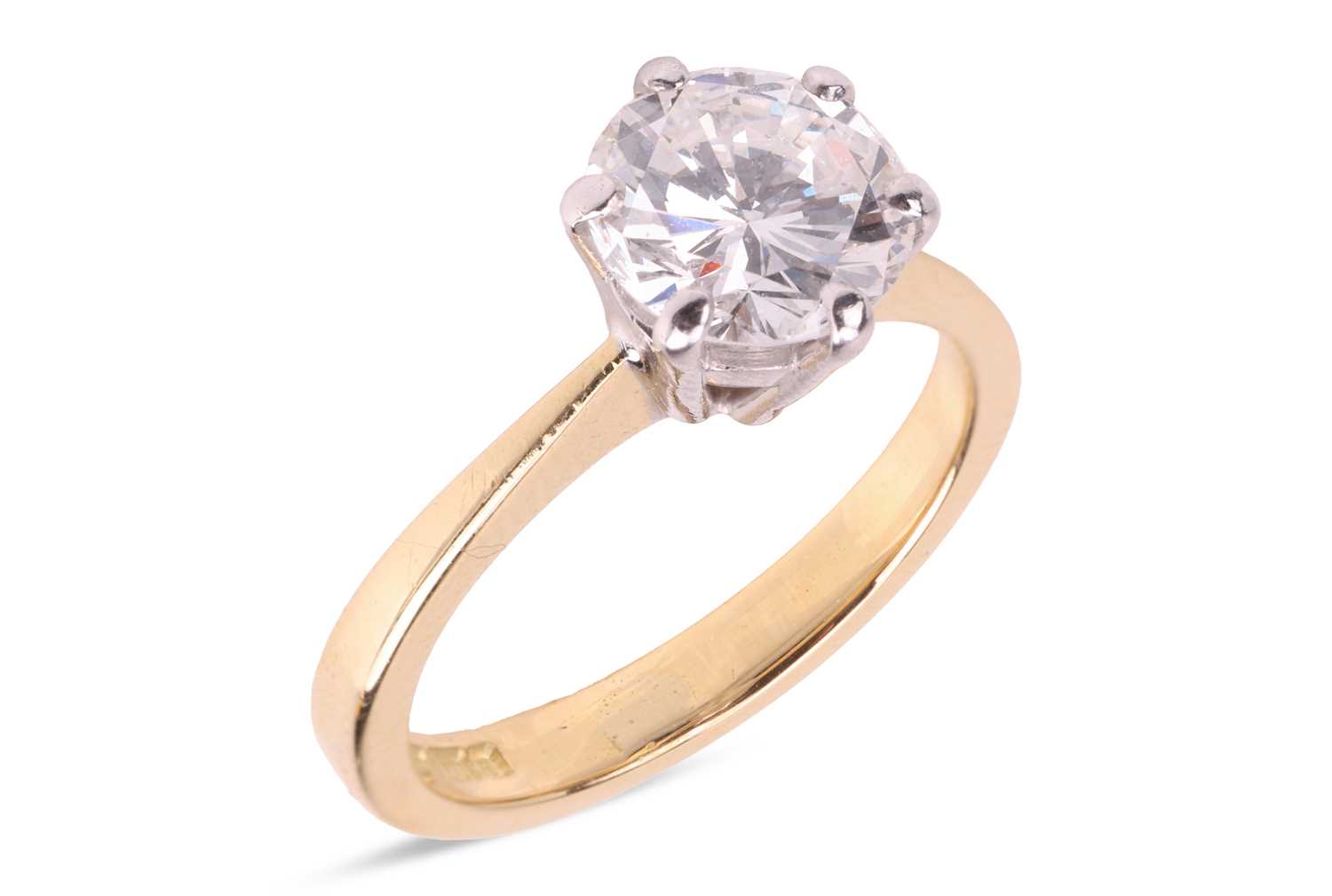 Lot A diamond solitaire ring in 18ct gold, the...