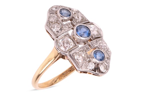 Lot 91 - A sapphire & diamond panel ring, featuring...