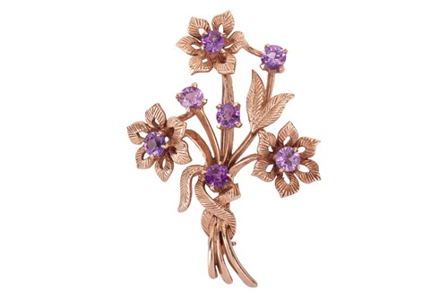 Lot 114 - An amethyst-set spray brooch in 9ct gold, the...