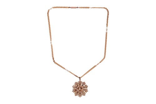 Lot 36 - A split pearl floral pendant on chain, the...
