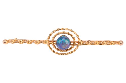 Lot 35 - An opal bar brooch, of target design, centred...