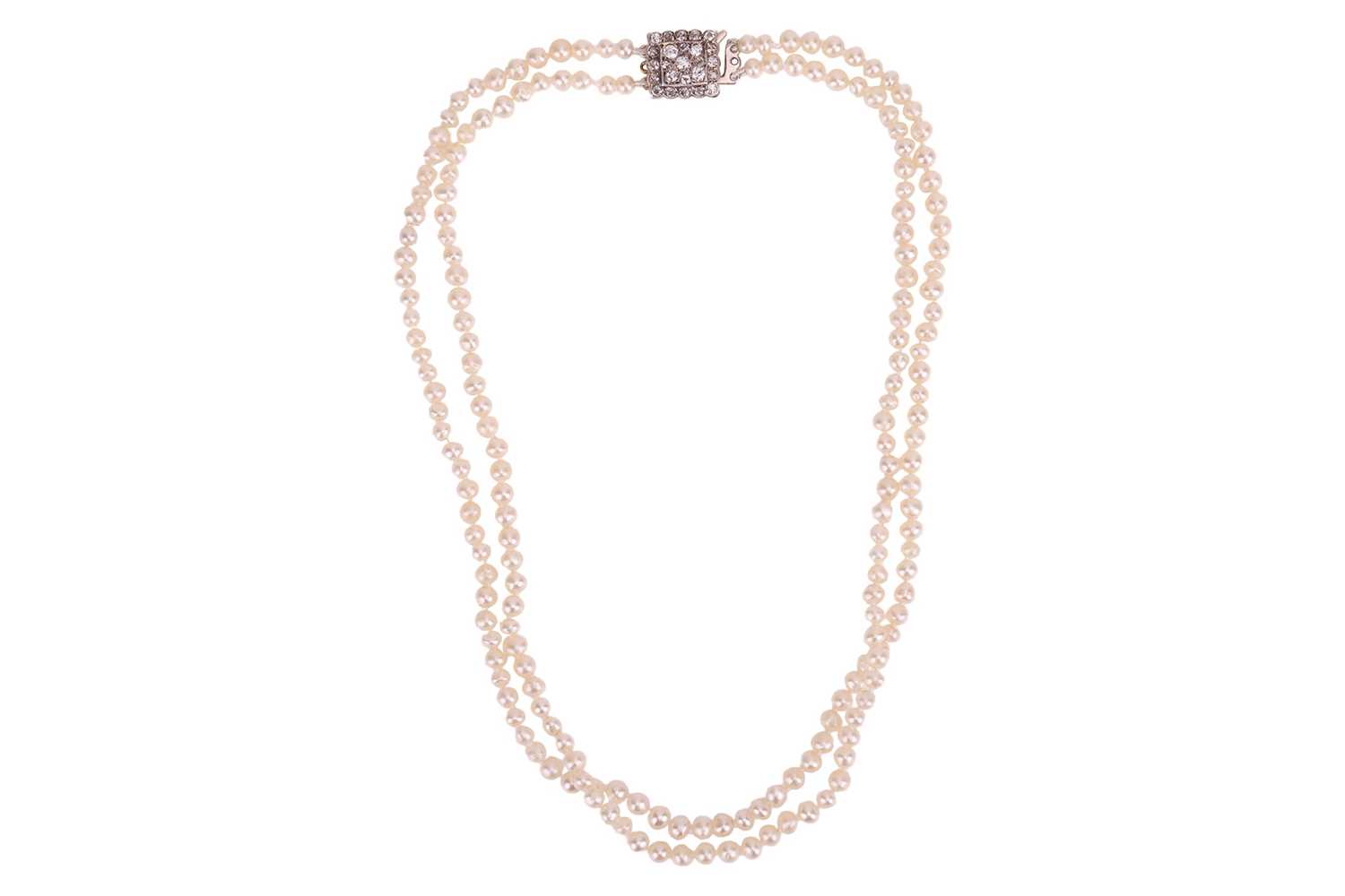Lot A double-row natural saltwater pearl necklace,...