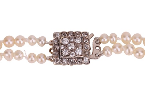Lot A double-row natural saltwater pearl necklace,...