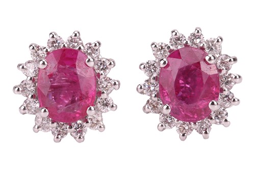 Lot 202 - A pair of ruby and diamond cluster stud...