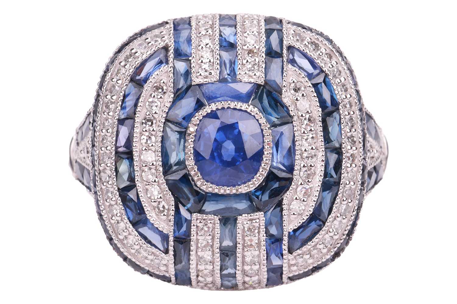 Lot A panel ring set with sapphire and diamond,...