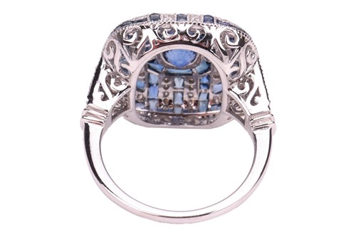 Lot A panel ring set with sapphire and diamond,...
