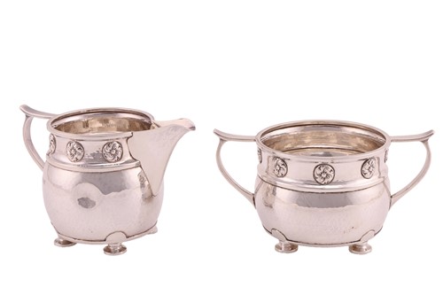 Lot An Arts and Crafts silver creamer and sugar...