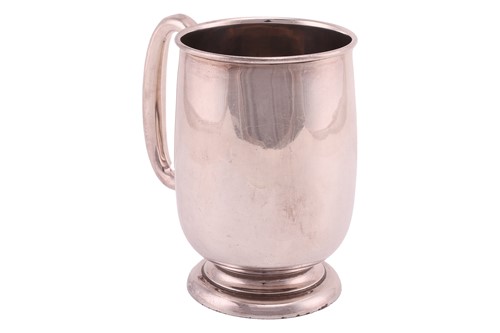 Lot A silver pint tankard, polished plain body...