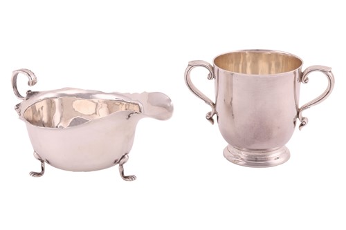 Lot 247 - A silver twin-handled cup on stepped foot, by...