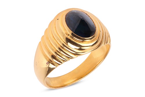 Lot A sapphire cabochon dress ring, comprising a...