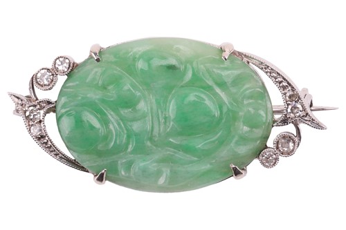 Lot A Late Art Deco carved jadeite and diamond...