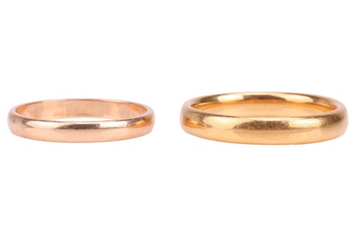 Lot 96 - A wedding band in 22ct gold, polished...