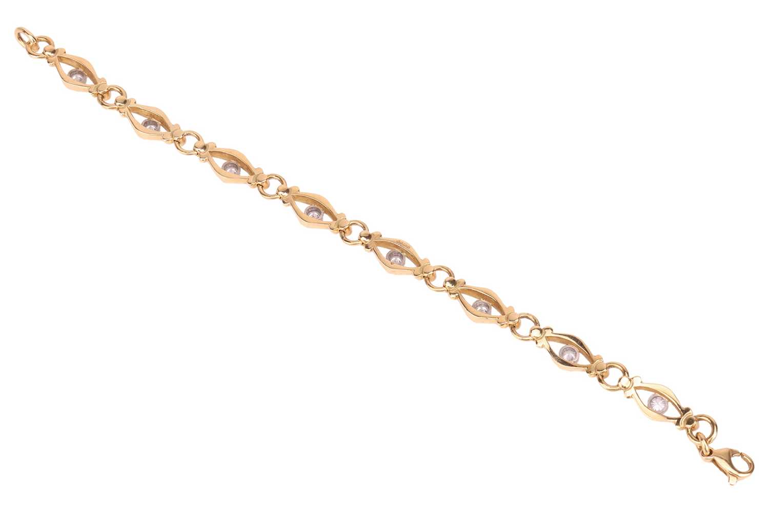 Lot A diamond-set fancy link bracelet in 18ct gold,...