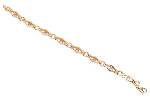Lot A diamond-set fancy link bracelet in 18ct gold,...