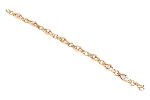 Lot A diamond-set fancy link bracelet in 18ct gold,...