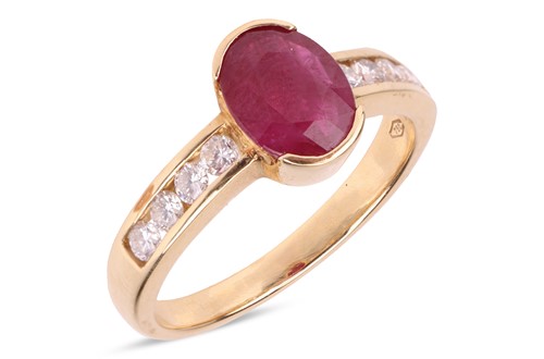 Lot 198 - A ruby and diamond dress ring, centred with an...