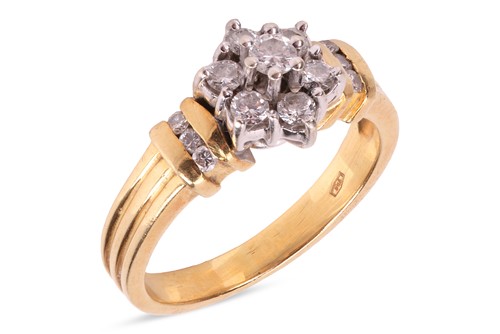 Lot 273 - A diamond cluster ring, featuring a central...